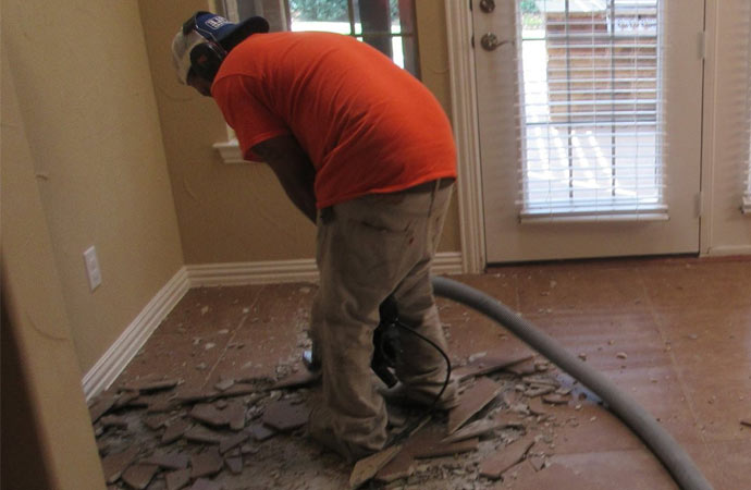 Professional worker using advance tile removal equipment